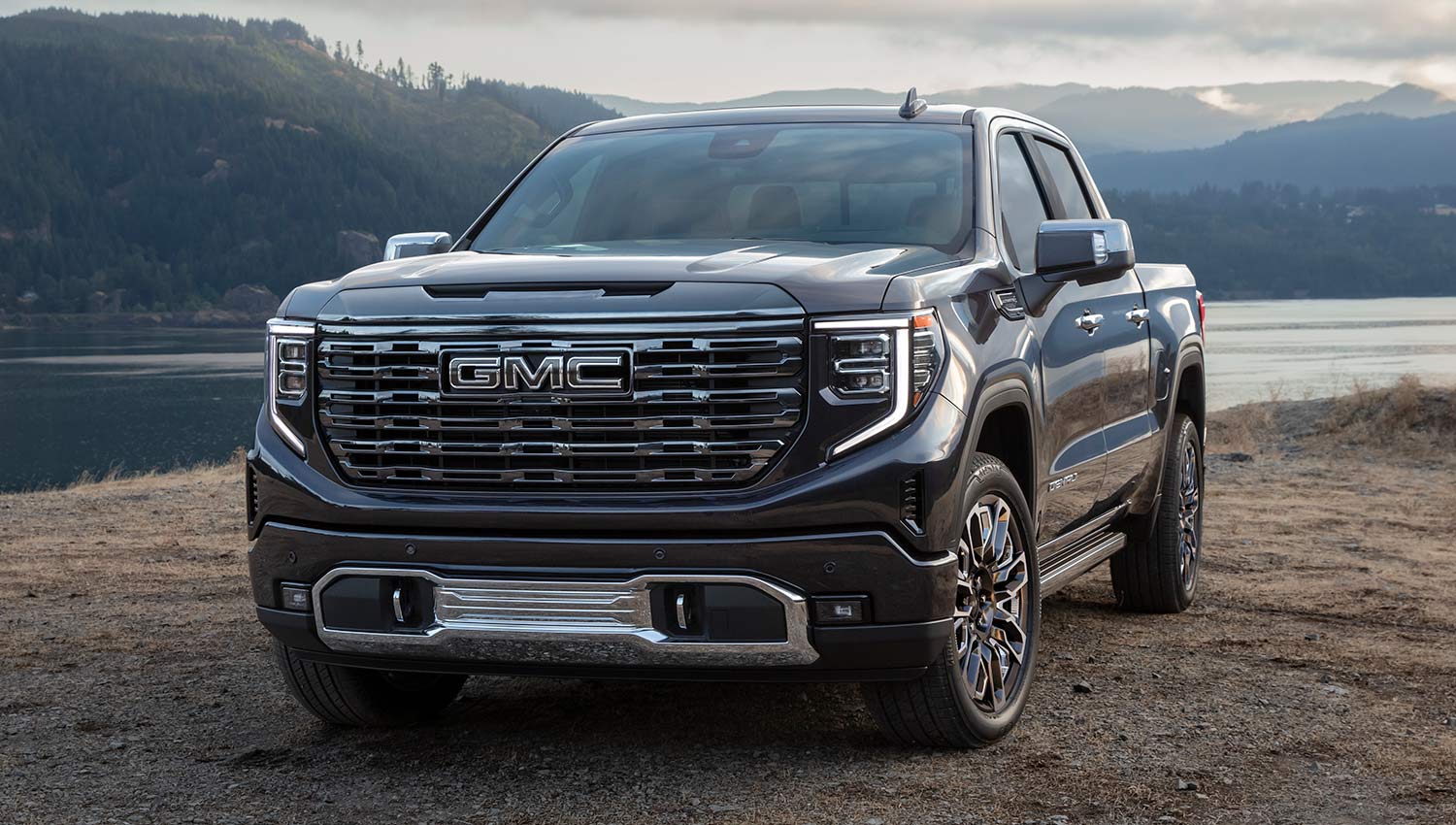GMC truck next to a river